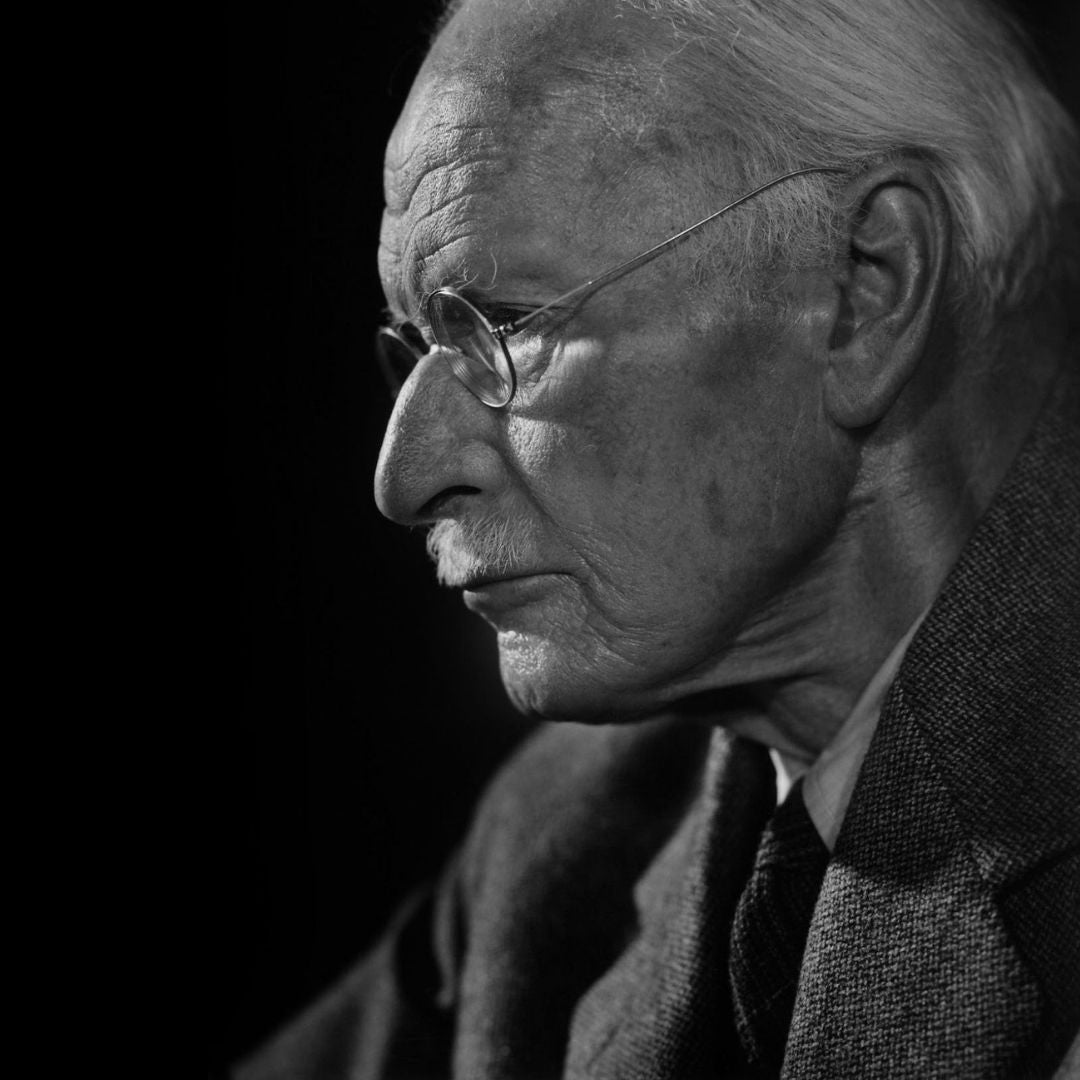 Black-and-white image of Carl Jung, whose teachings inspired the emotional depth of The Collector’s Stories experience.